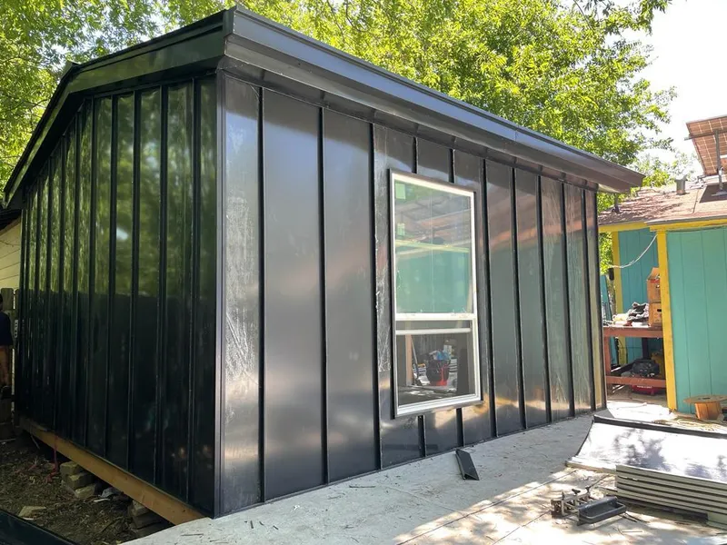 Black standing seam metal wall panels for Roof Inspection in North Druid Hills